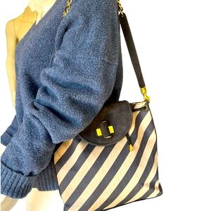 Claudio Merazzi Italian shoulder bag with flashy gold hardware. Hobo style cinch